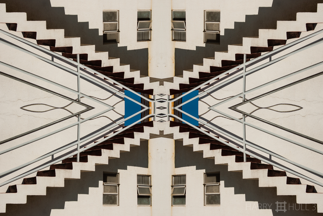 Upstairs/downstairs. Photo of stairs on exterior of small oval building housing restrooms in Aquatic Park complex, San Francisco Maritime National Historical Park, California.