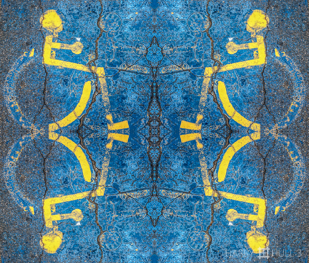 Parking lot icon. iPhone photo of handicap parking symbol on pavement of Crosby's Market parking lot, Manchester, Massachusetts.