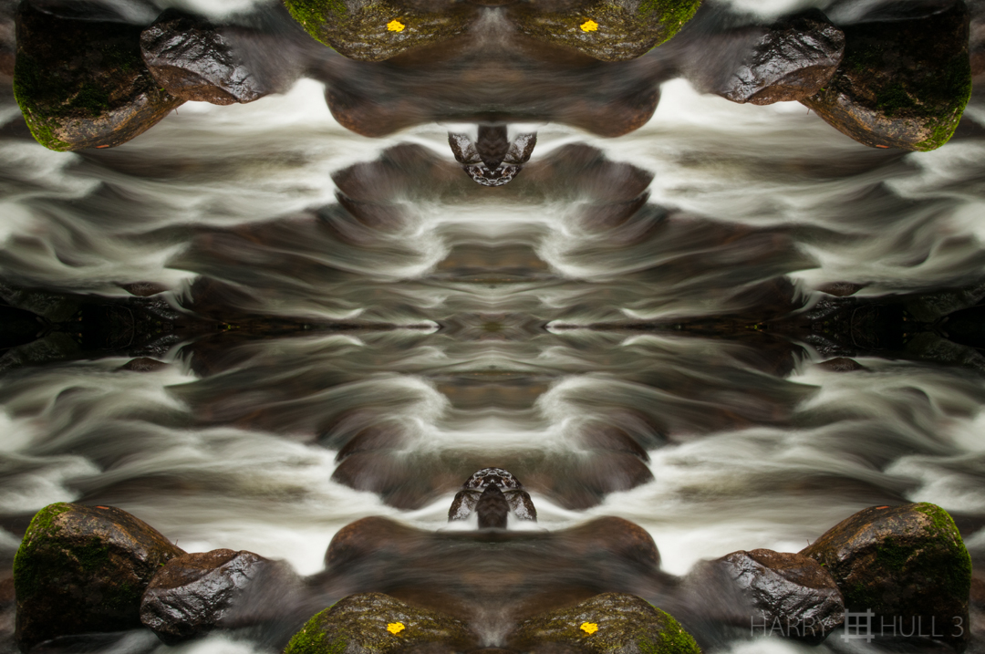 River goddess? Photo of river flow and rocks in the forest of Hacienda la Amistad, Costa Rica.