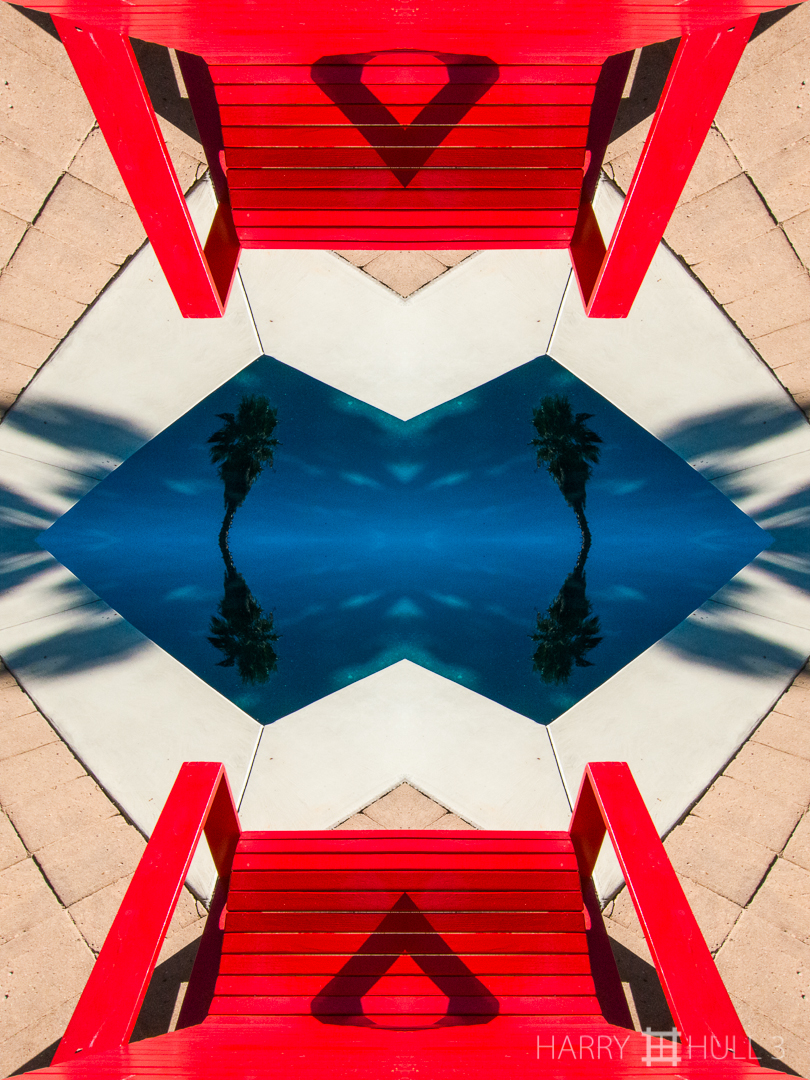 Pool furniture. Photo of an Adirondack chair near a swimming pool, northern California.