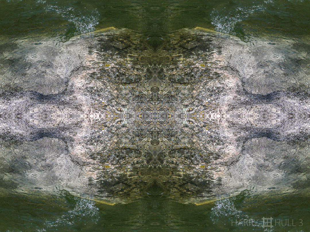 Water over stone. Photo of river flowing over granite rock, Tenaya Creek, Yosemite National Park, California.