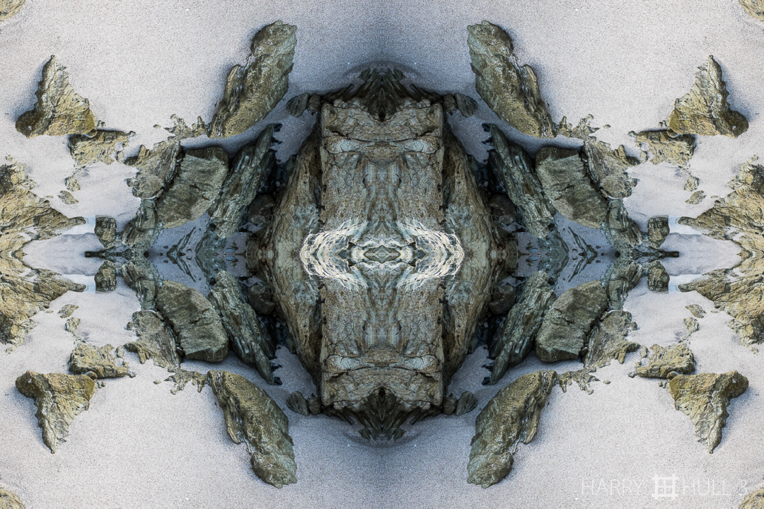 Sandscape. Photo of rocks emerging from sand at low tide on Playa Santa Teresa, Nicoya Peninsula, Costa Rica.