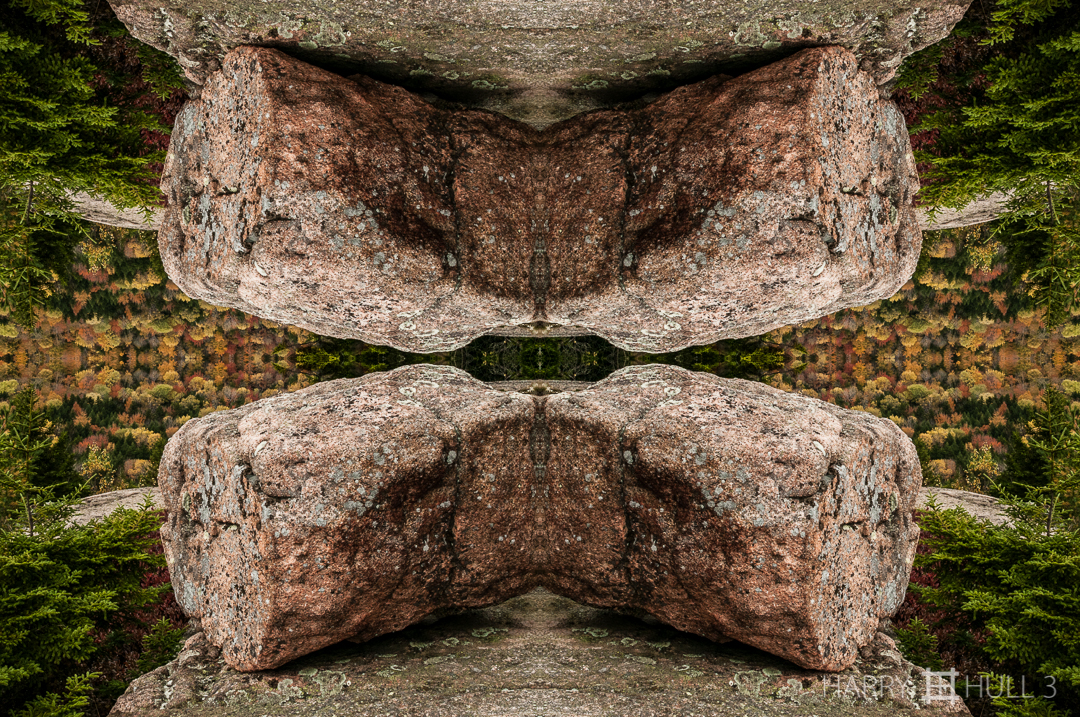 Granite attraction. Photo of glacial erratic boulder on a granite ledge, the Bubbles, Acadia National Park, Mount Desert Island, Maine.