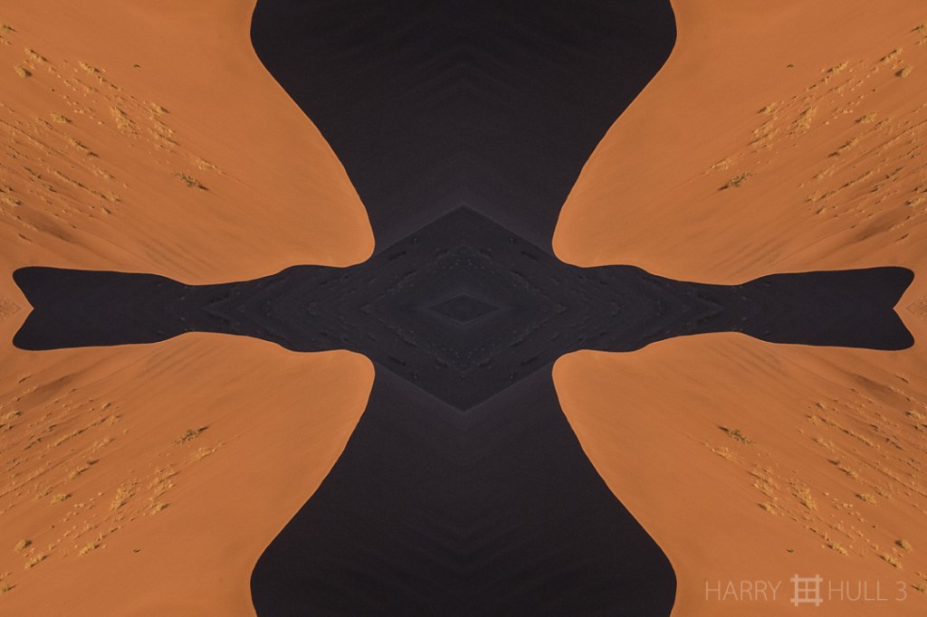 Dune shadow. Photo of part of a large sand dune at sunrise in the Sossusvlei Dune area of Naukluft-Sossusvlei National Park, Nambia, Africa.